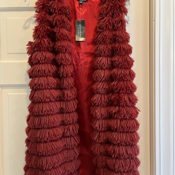 Tops - Red vest. Feathers? Fur? Not sure but really soft